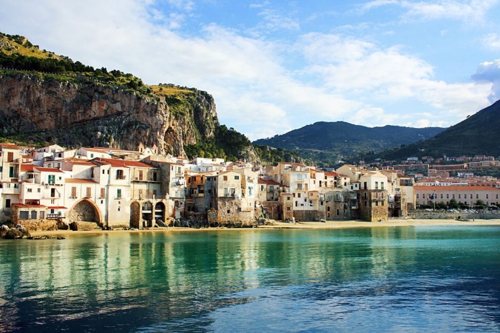 Cefalu on the northern coast of Sicily is a sleepy fisherman village that has nailed the quintessential Sicilian charm and makes it on our list of Italian coastal towns to visit!