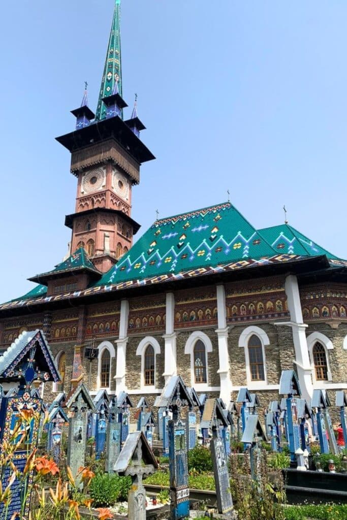 The Merry Cemetery surrounds and equally beautiful old school Maramures style church.